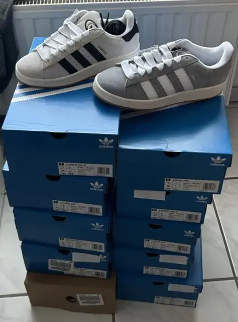 Two pairs of Adidas Campus on a stack of boxes