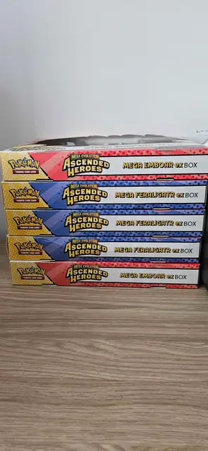 Five Pokémon Ascended Heroes boxes stacked on the floor