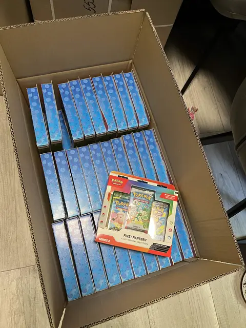 A shipping box packed with Pokémon ETBs